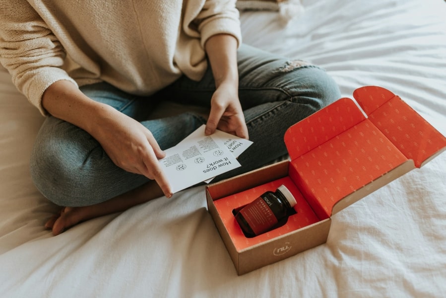 Girl with a package received thanks to online shopping, possibly in Germany and possibly supporting German e-commerce in 2025